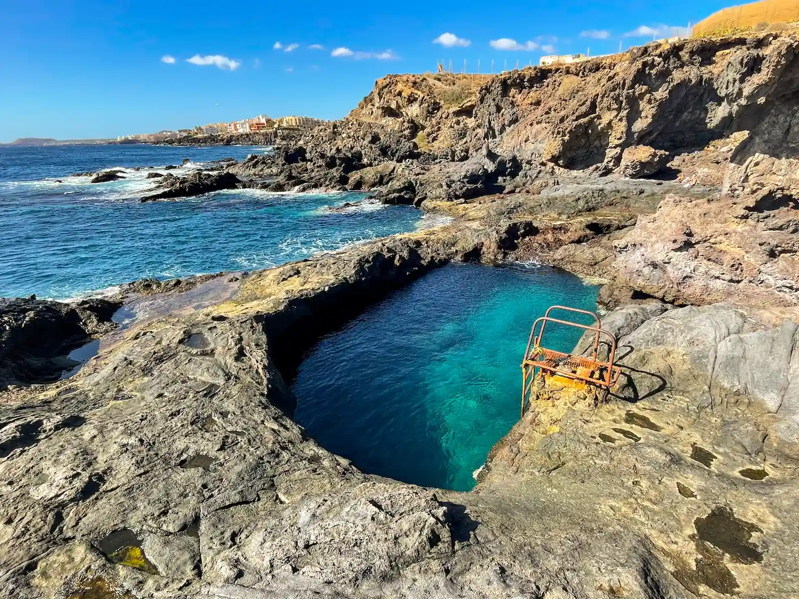 Natural swimming pool Los Abrigos with metal stairs