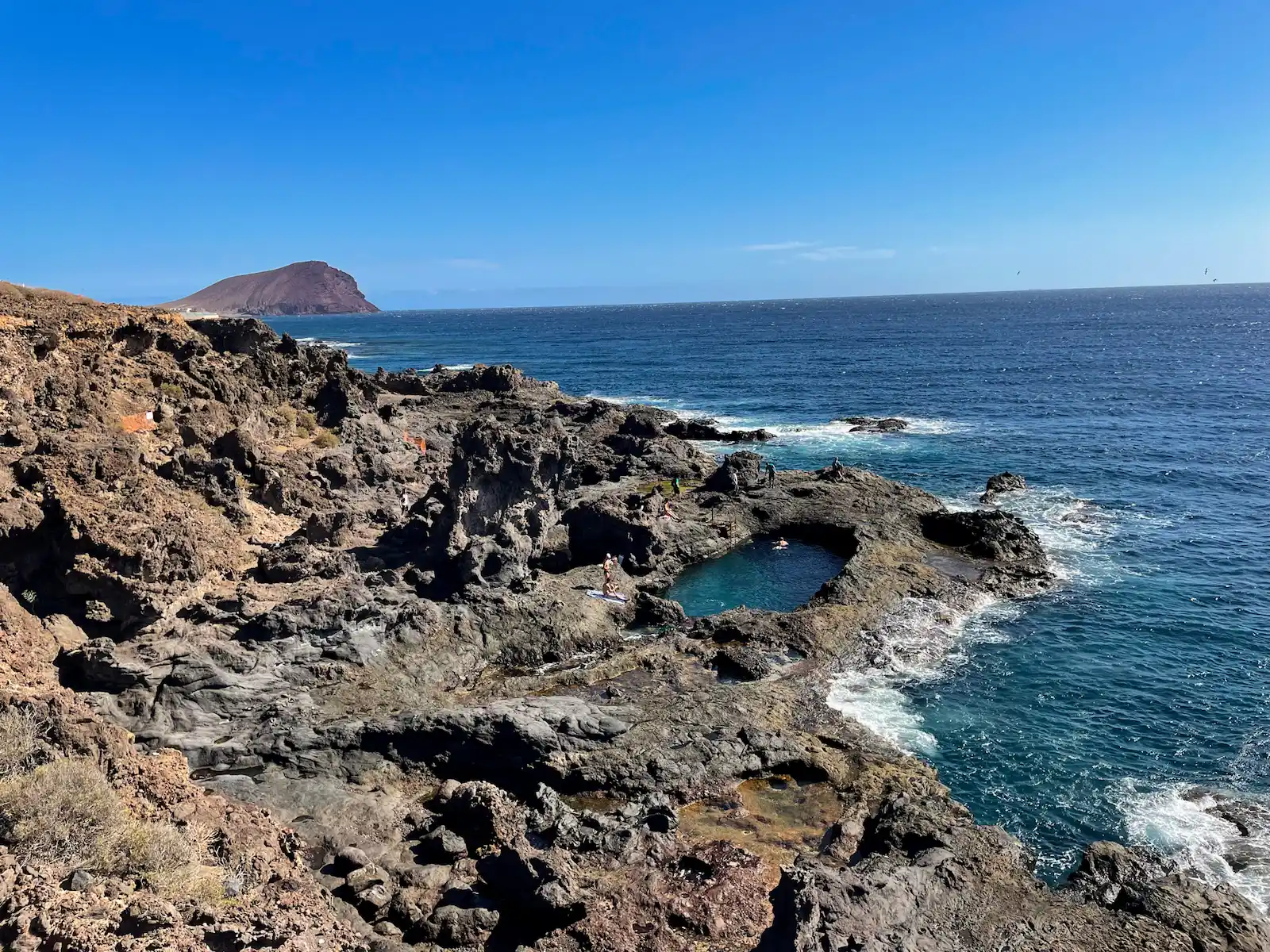 Los Abrigos natural pool with volcanic coast and ocean view