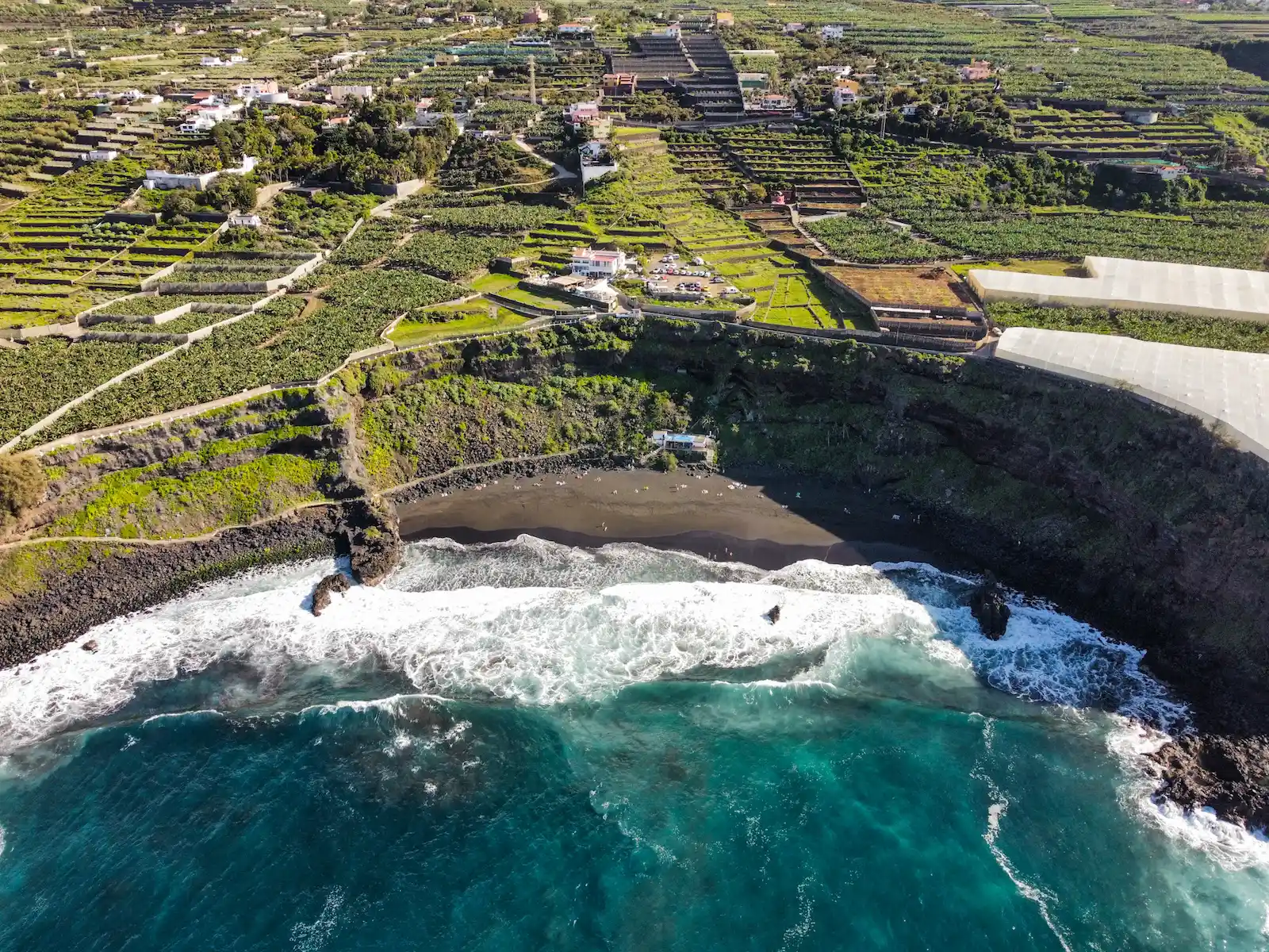 Aerial view of Playa de los Patos – a wide natural black sand beach