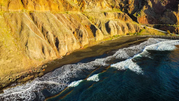 Waves rolling onto the black sand at Playa de Las Gaviotas