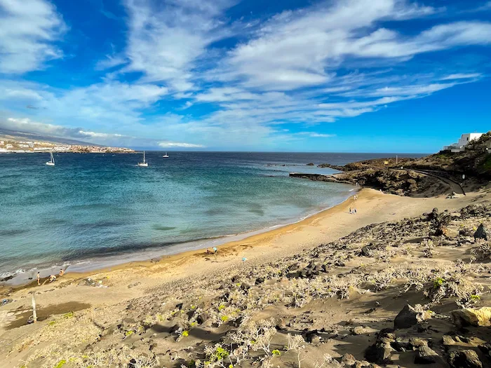 Turquoise bay at Playa Grande with boats on the horizon