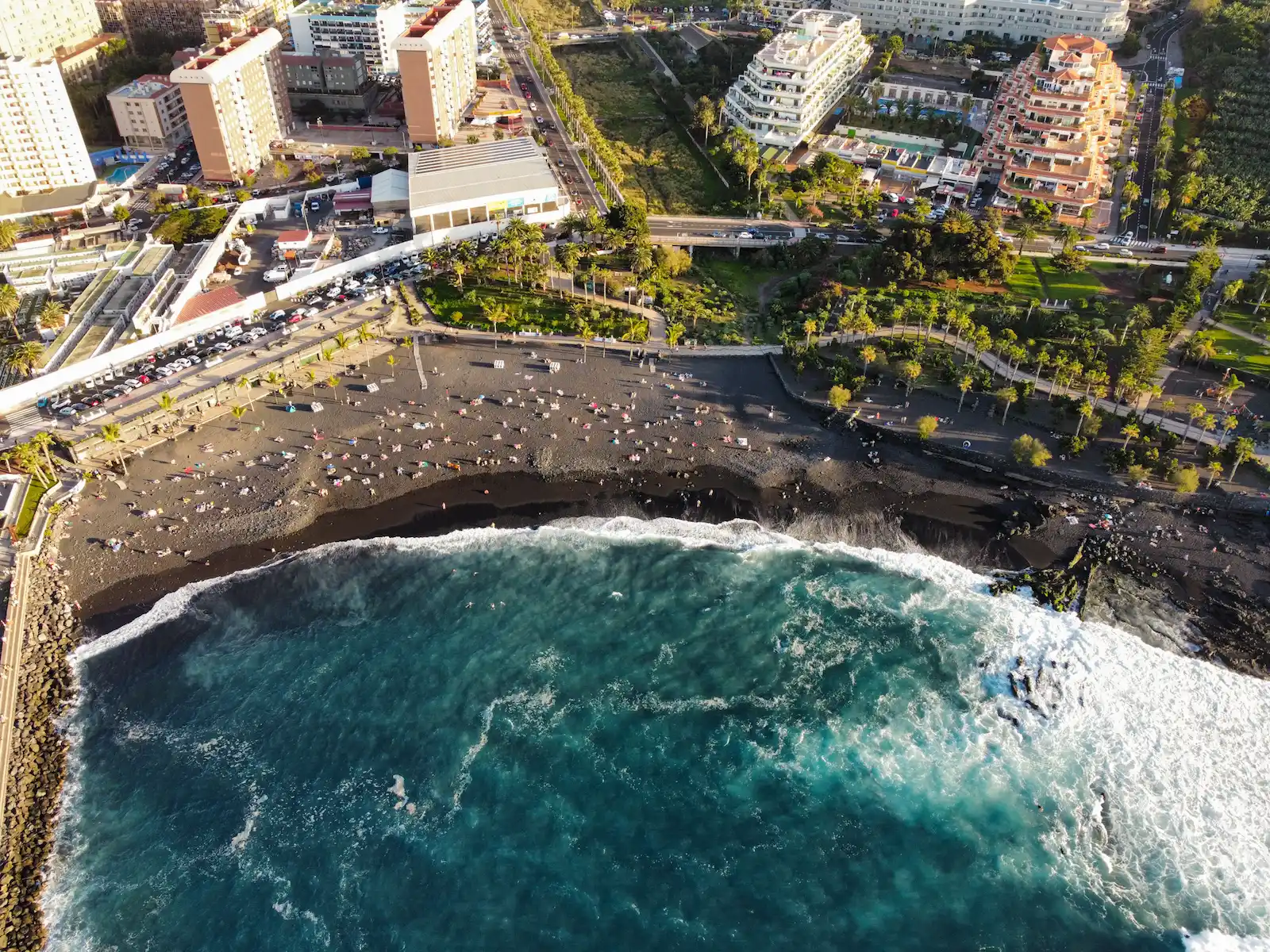 Playa Martiánez with hotels and crashing Atlantic waves in Puerto de la Cruz.