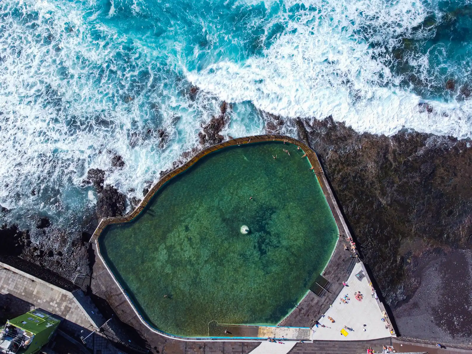 Punta del Hidalgo natural pool from above with turquoise water and waves