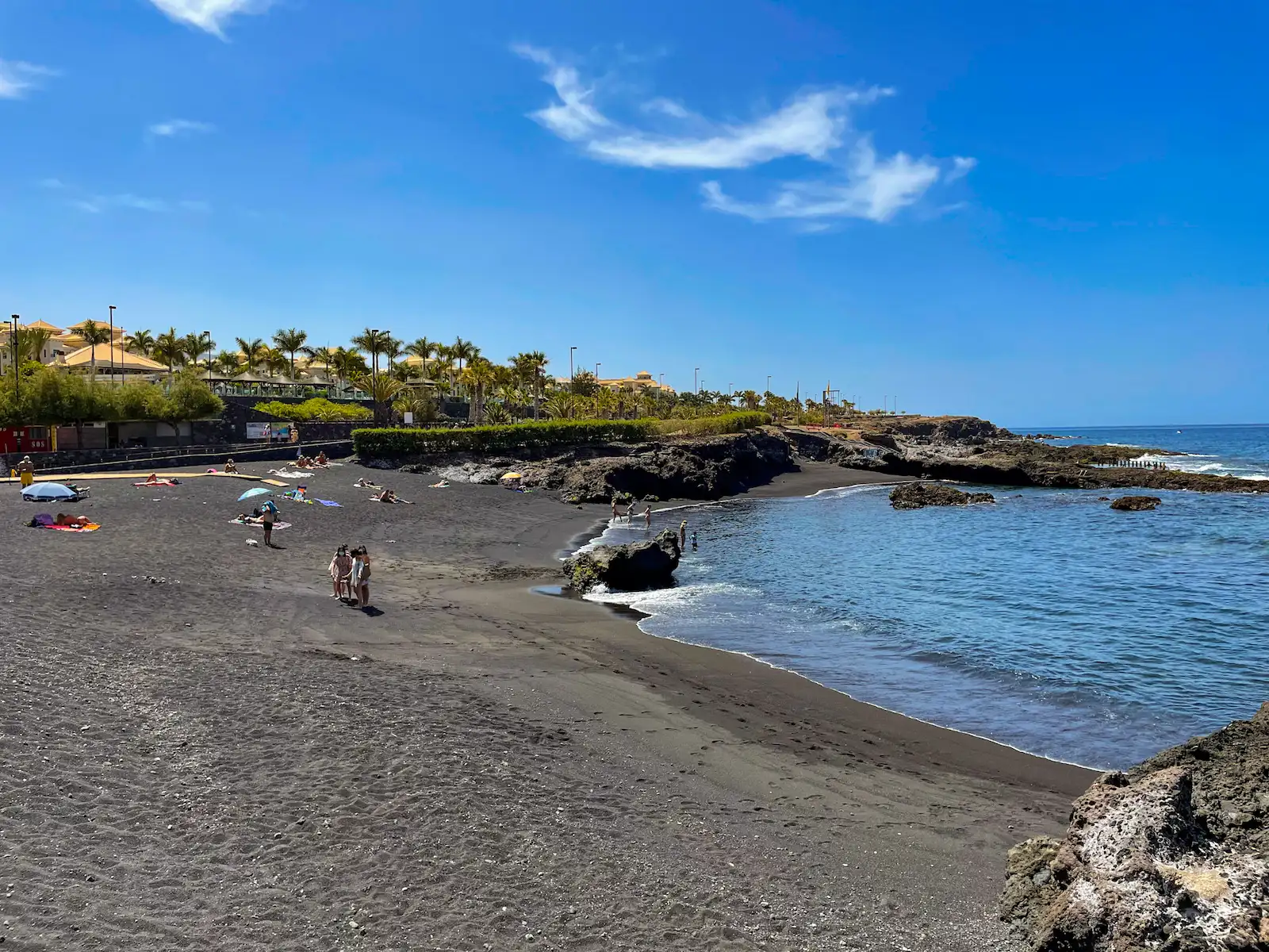 Playa de Alcalá in Tenerife with black sand and calm Atlantic water