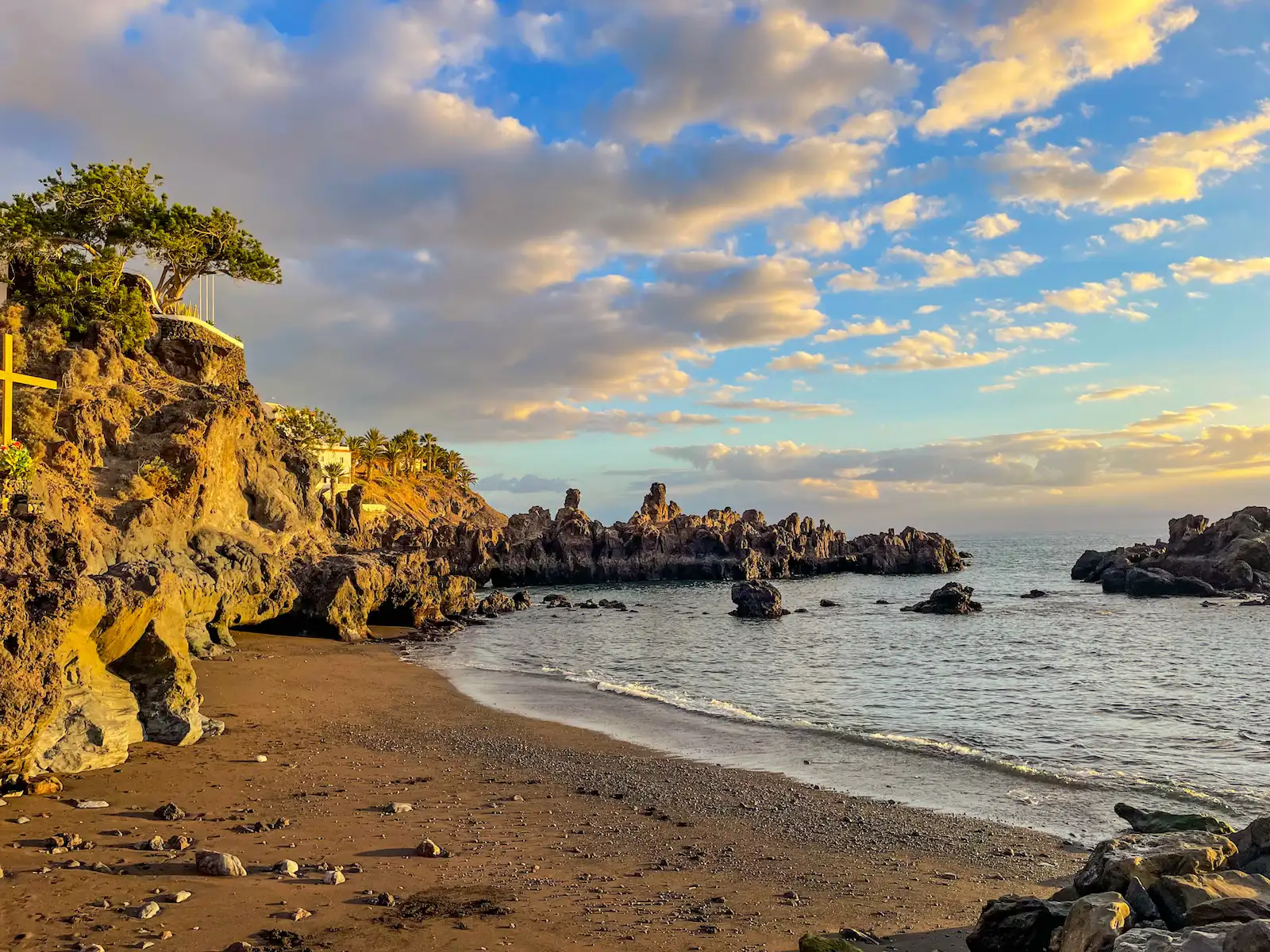 Volcanic rocks and sunset at Playa de Alcalá beach in Tenerife