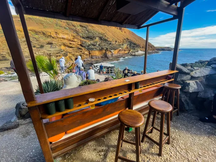 Beach bar by Playa Montaña Amarilla cliffs in Tenerife