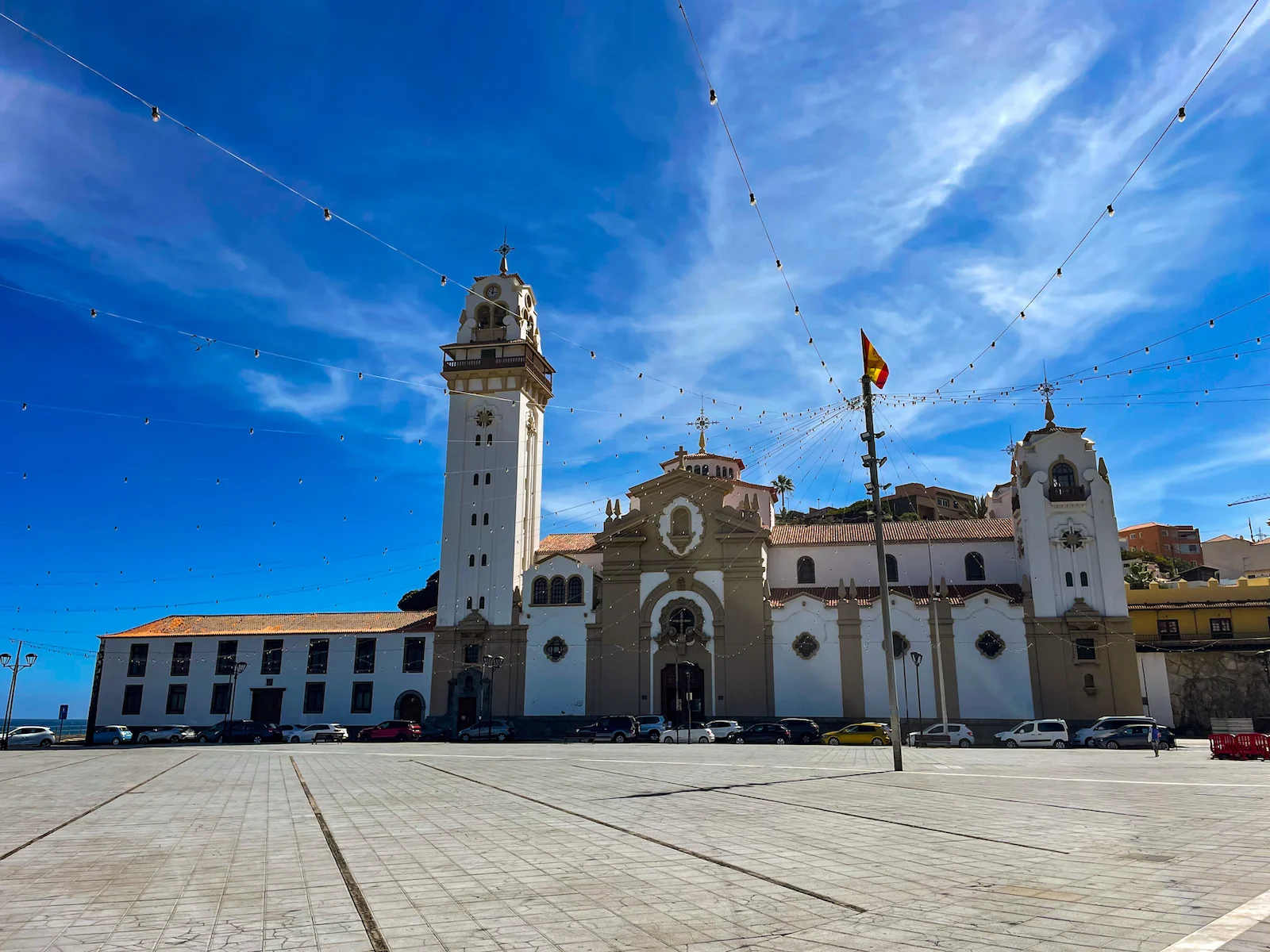 Wide front view of the Basilica of Candelaria under a clear sky