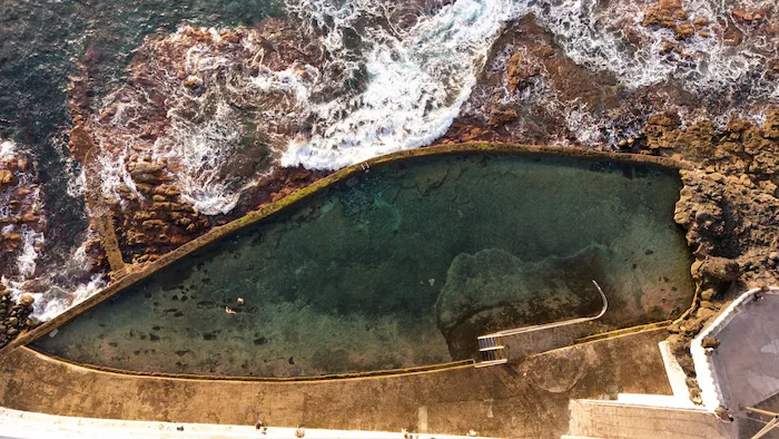 volcanic pool in El Pris Tenerife with waves crashing over the edge
