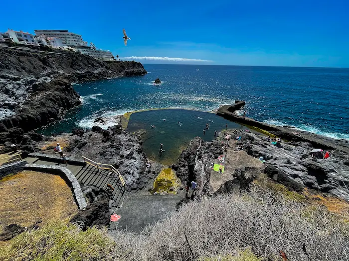 Los Gigantes natural pool with access stairs and ocean view
