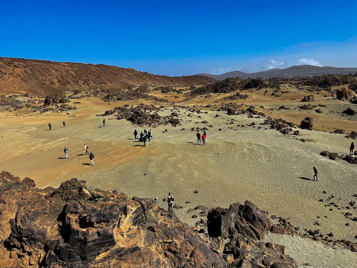 Visitors walking through Minas de San José volcanic plain in Tenerife