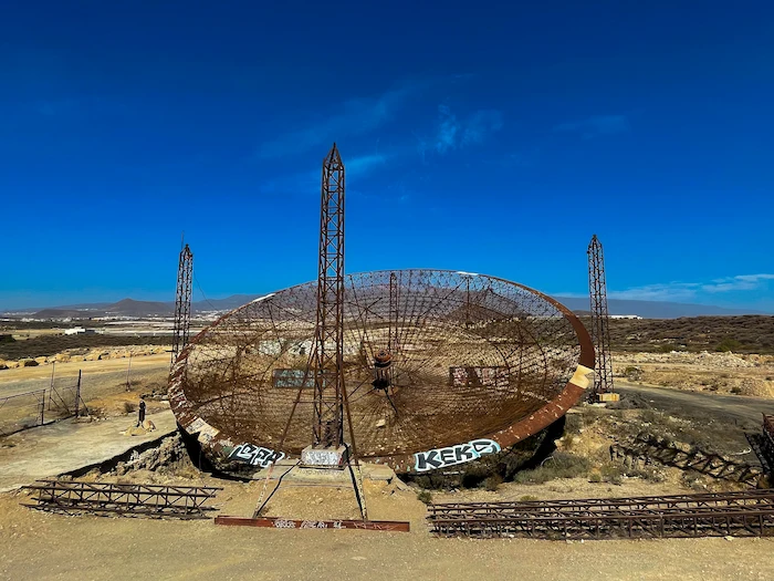 Frontal view of abandoned antenna in Tenerife with graffiti