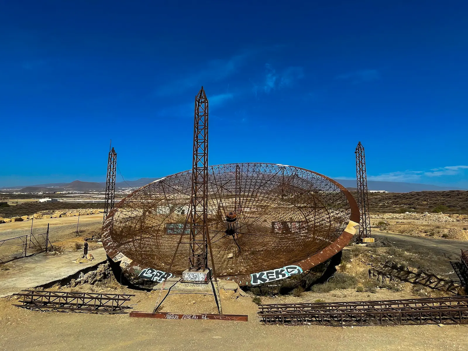 Frontal view of abandoned antenna in Tenerife with graffiti
