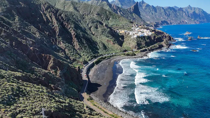 Playa de Benijo with black sand and green cliffs in Anaga, Tenerife