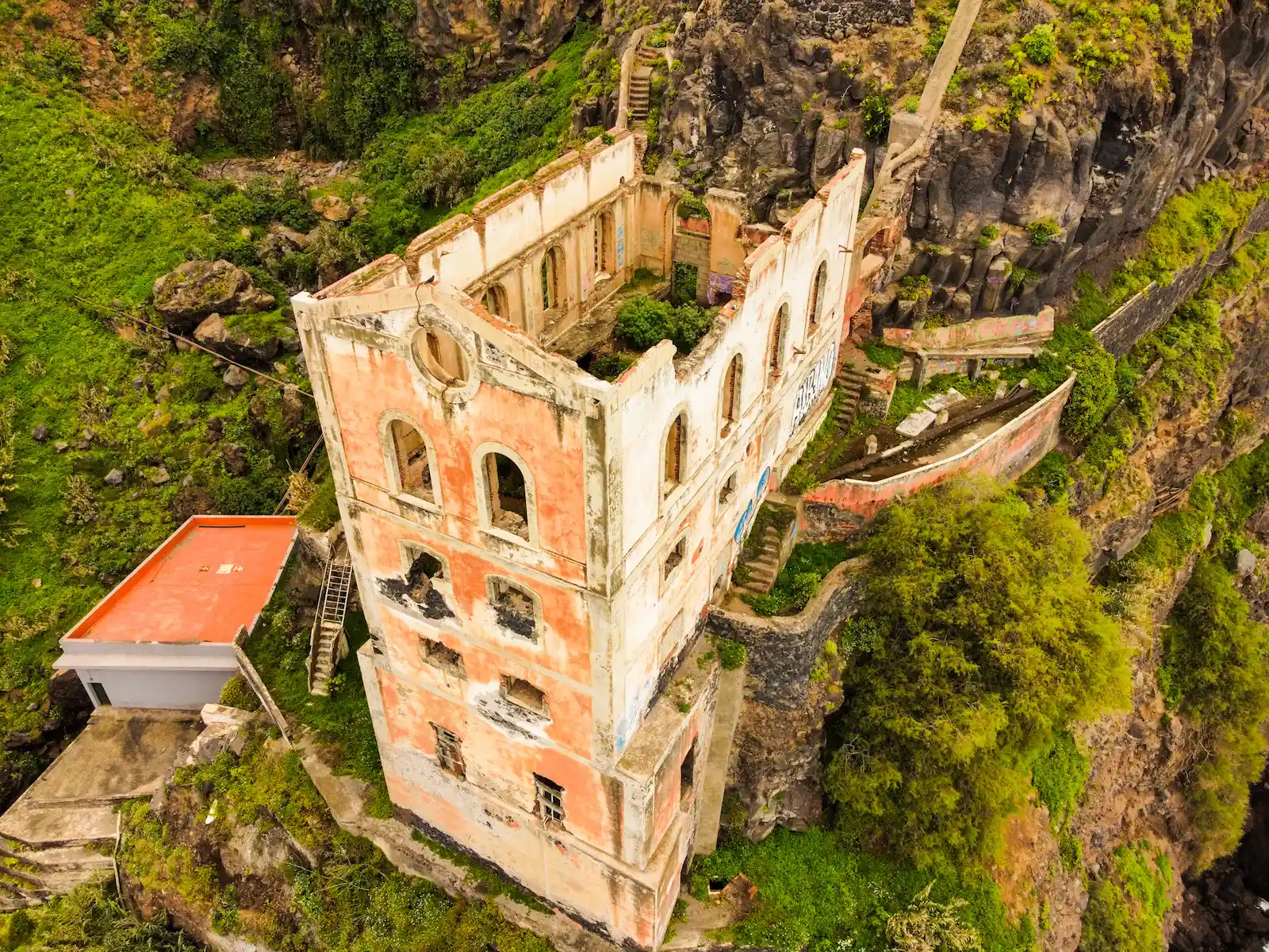 Aerial view of Casa Hamilton ruins in Tenerife surrounded by green cliffs