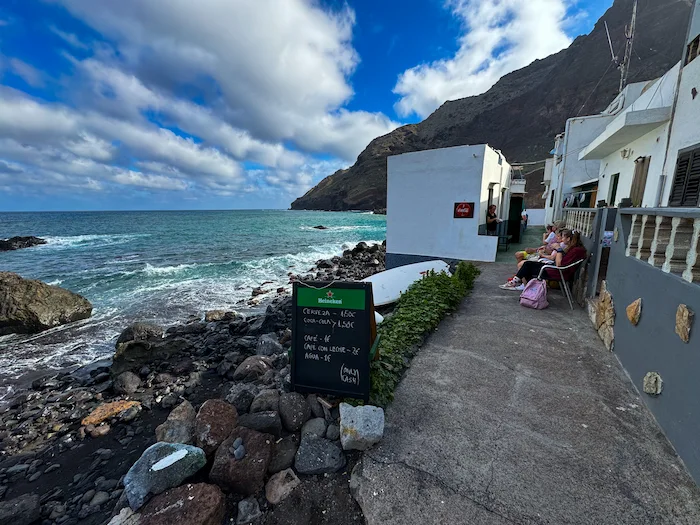 Path through Roque Bermejo village with ocean backdrop
