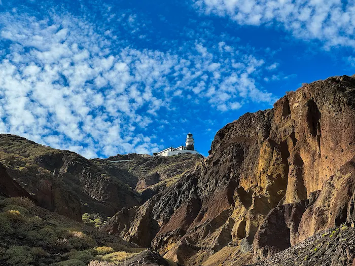 Faro de Anaga lighthouse between volcanic cliffs