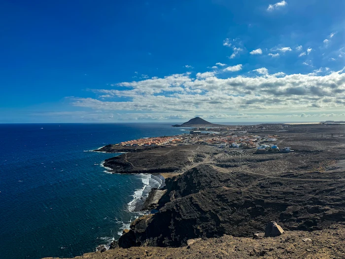 Aerial coastal view of El Médano with Montaña Roja in the distance