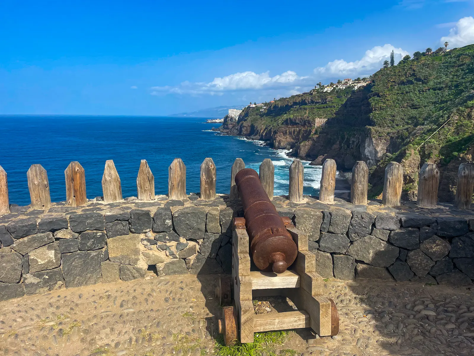 Historic cannon overlooking the cliffs on the Rambla de Castro trail