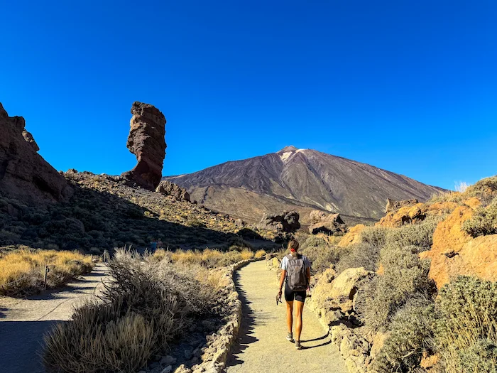 Roque Cinchado and Mount Teide with hiker on the trail