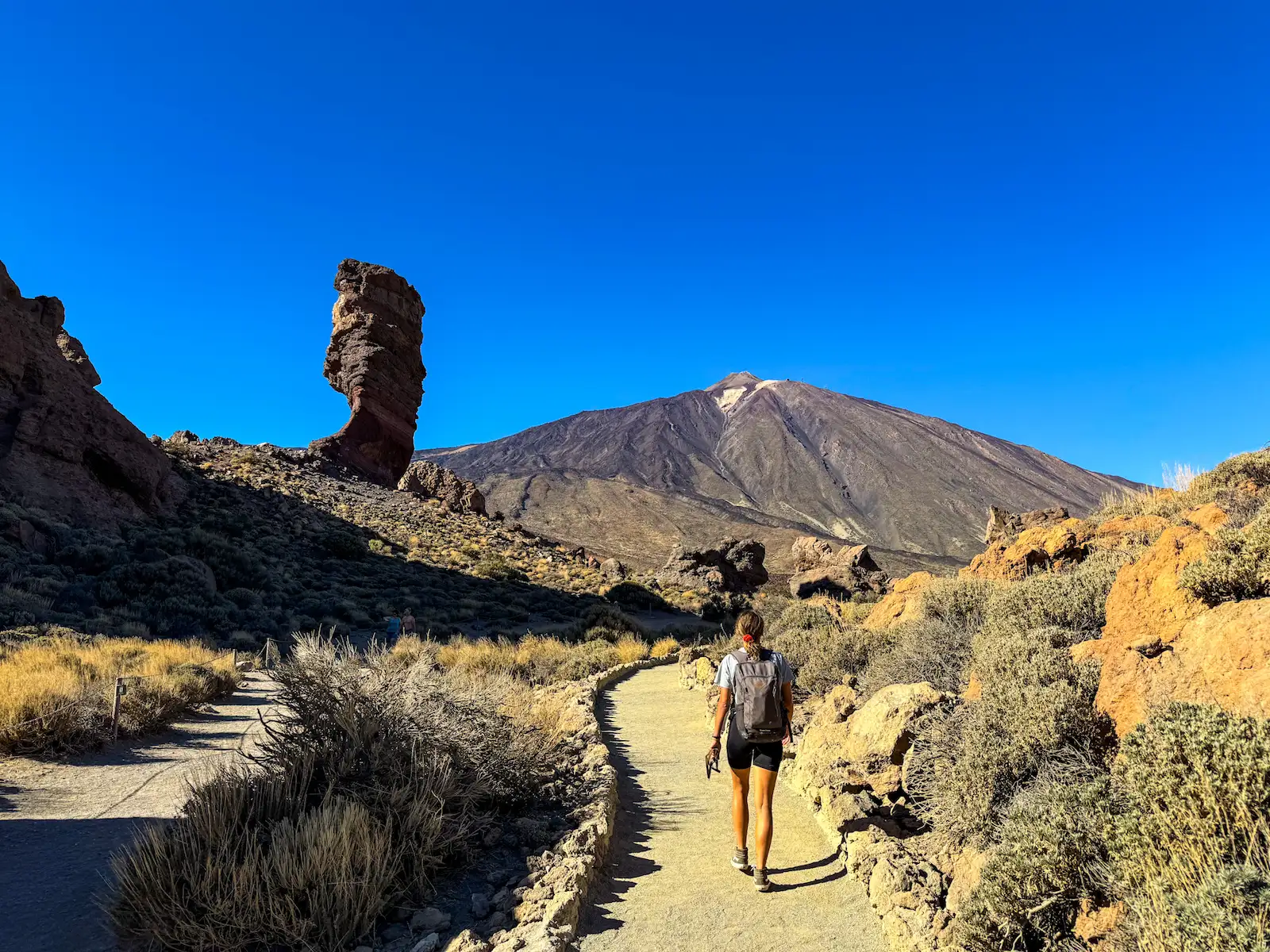 Roque Cinchado and Mount Teide with hiker on the trail