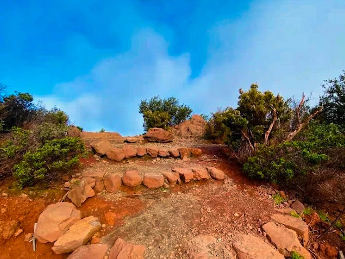Rocky steps with red volcanic soil on Masca Trail