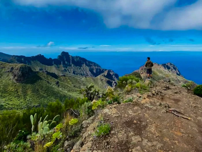Hiker on a ridge during Masca Hike with ocean in the background
