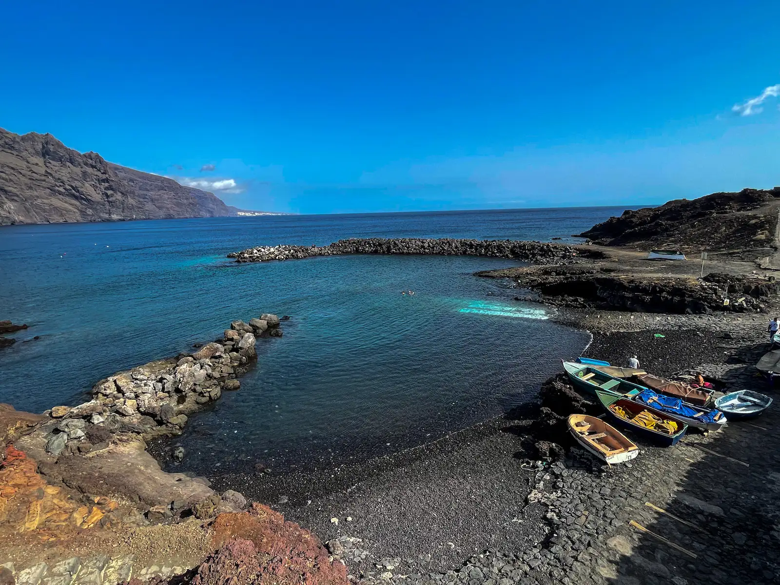 Small rocky beach with fishing boats at Punta de Teno, Tenerife