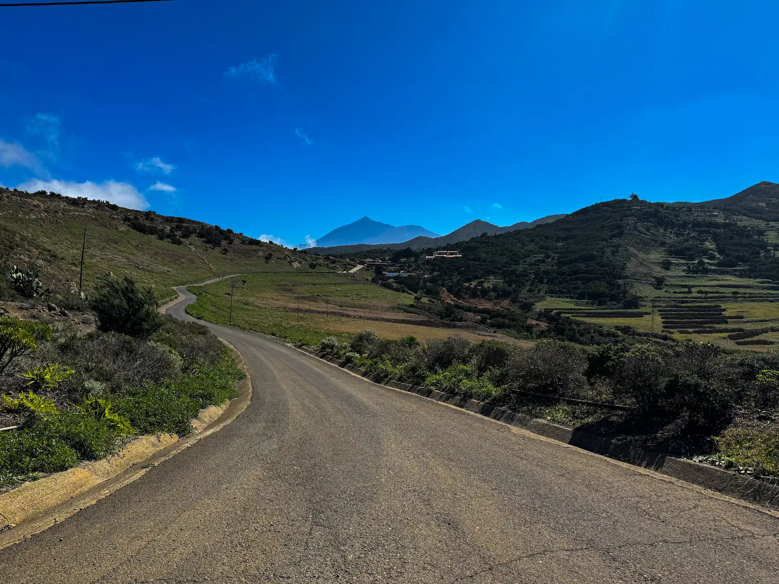 Winding road to Teno Alto village with Mount Teide in the distance